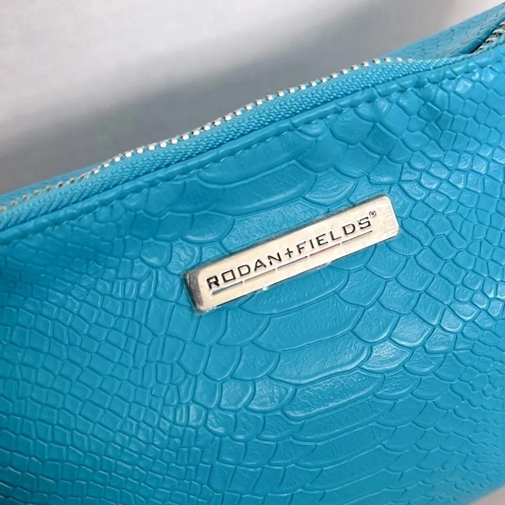 Vibrant Blue Rodan + Fields snake print Cosmetic Bag with Decorative Tassel